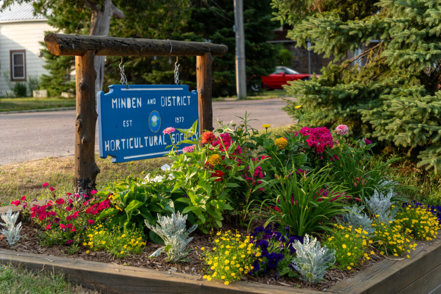 Minden and District Horticultural Society sign surrounded by colorful flowers, Minden Ontario